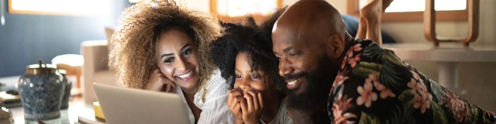 a family gathered around a laptop